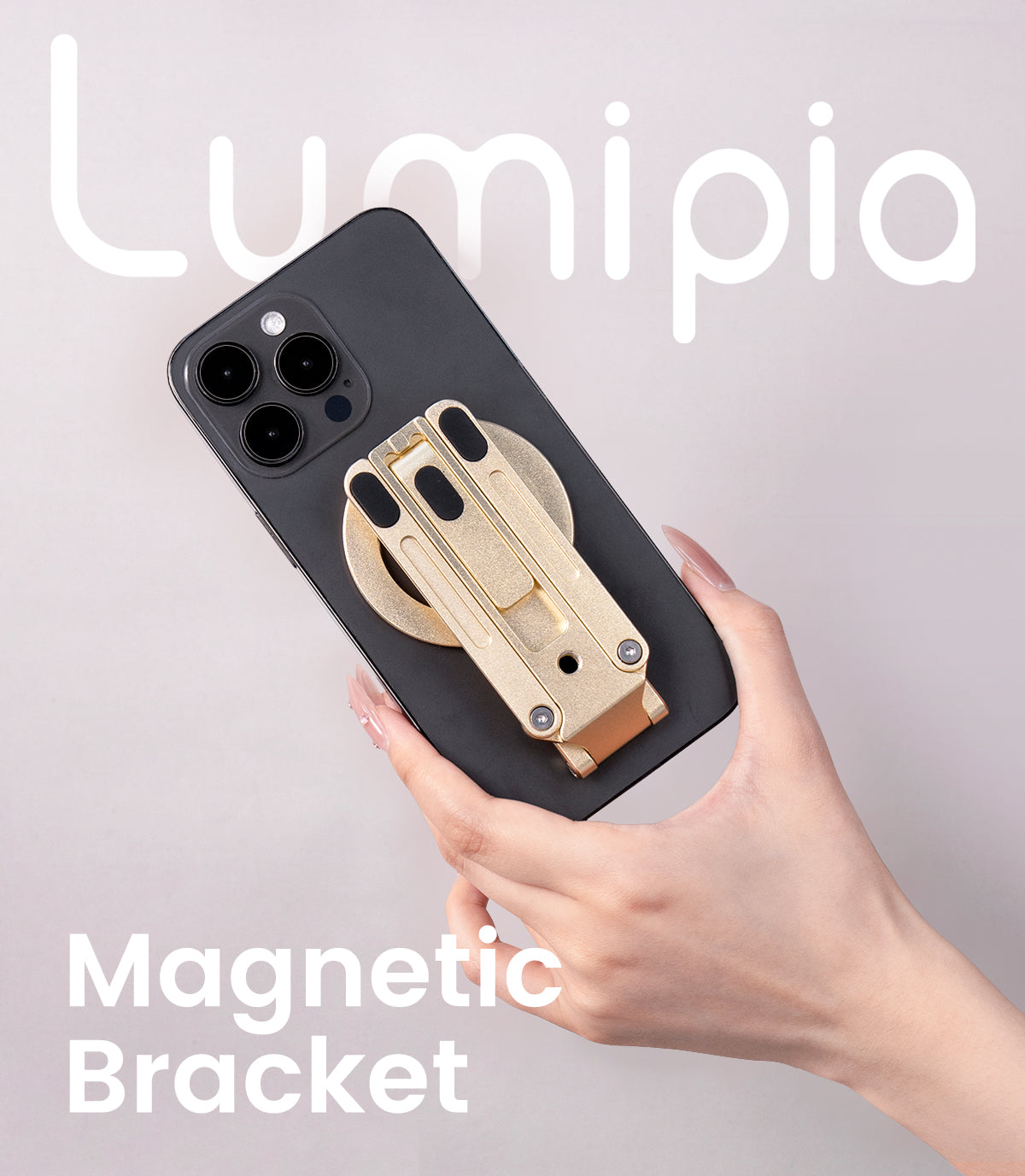  Lumipia Hand holding a phone with a gold magnetic bracket attached